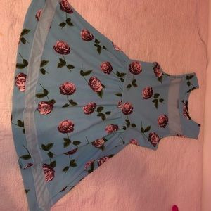 Light blue, floral design medium length dress.